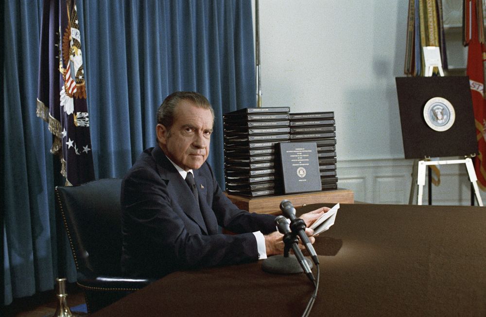 Richard Nixon on television beside binders of edited White House transcripts, April 1974